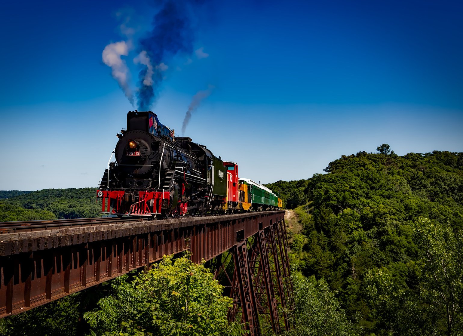 Steaming Train Passing a Railway